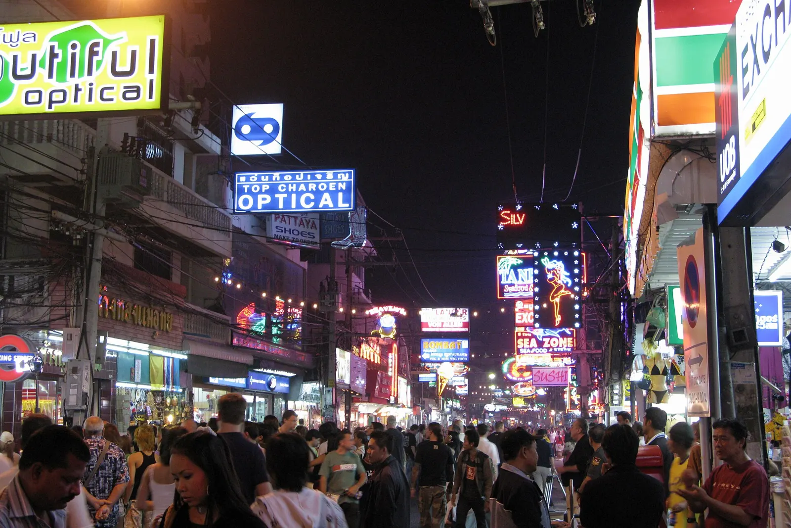 Walking Street in Pattaya at night, crowded under neon signs